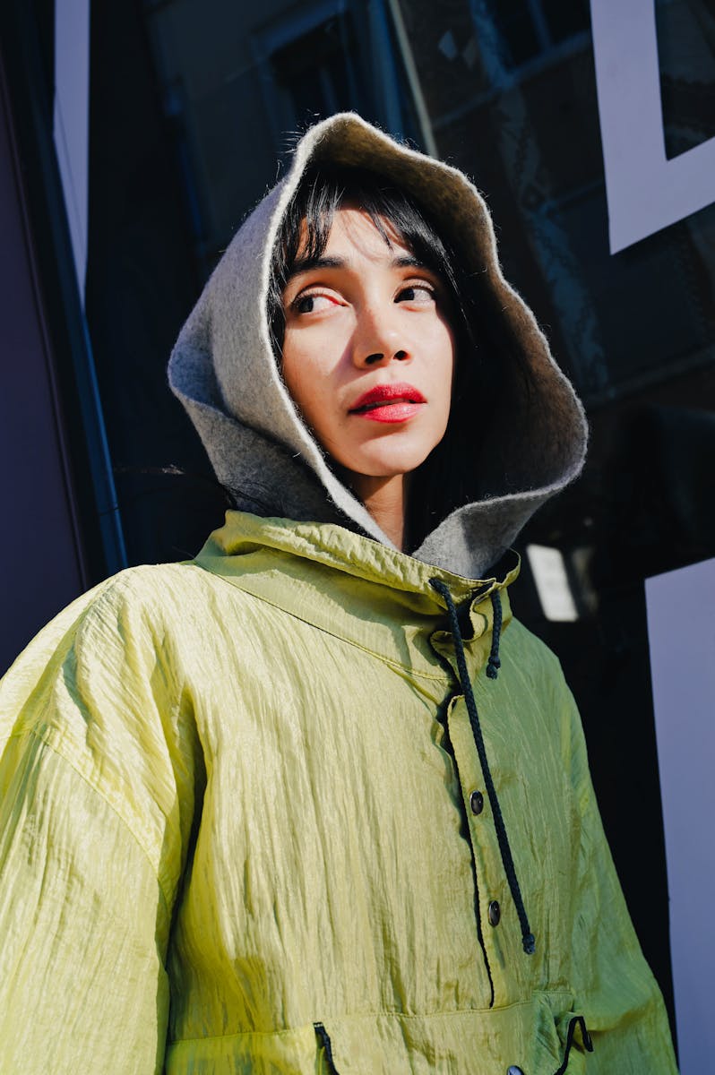 Stylish Woman in Green Jacket and Grey Hood